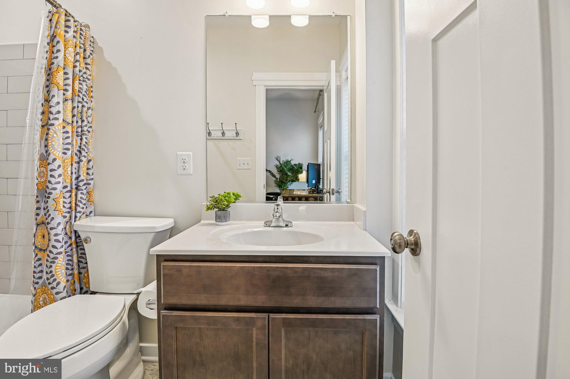 123 Lejeune Way Annapolis, MD 21401 - Photo 26 of 43 a bathroom with a sink and a toilet