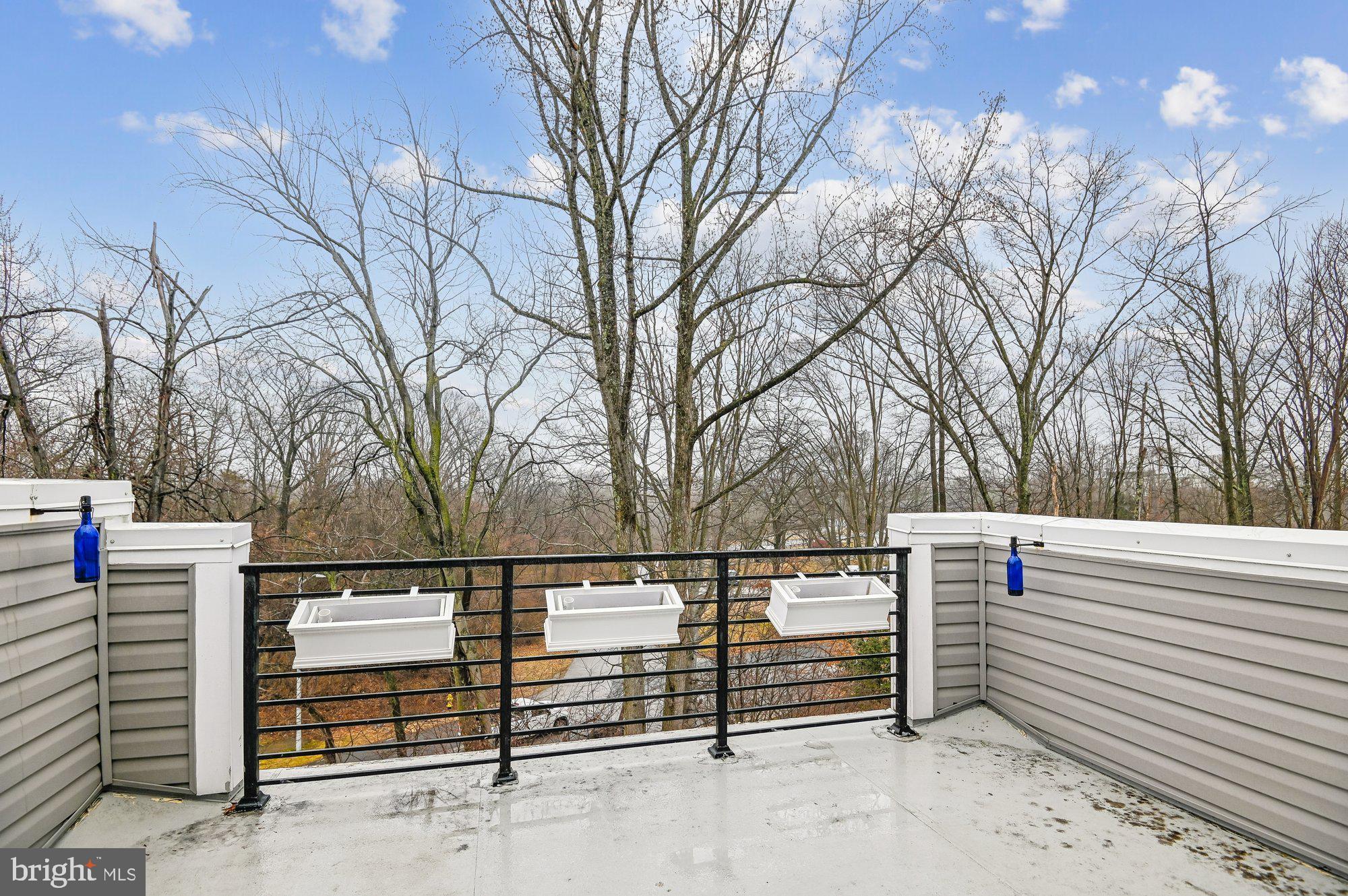 123 Lejeune Way Annapolis, MD 21401 - Photo 27 of 43 a view of a house with trees in the background