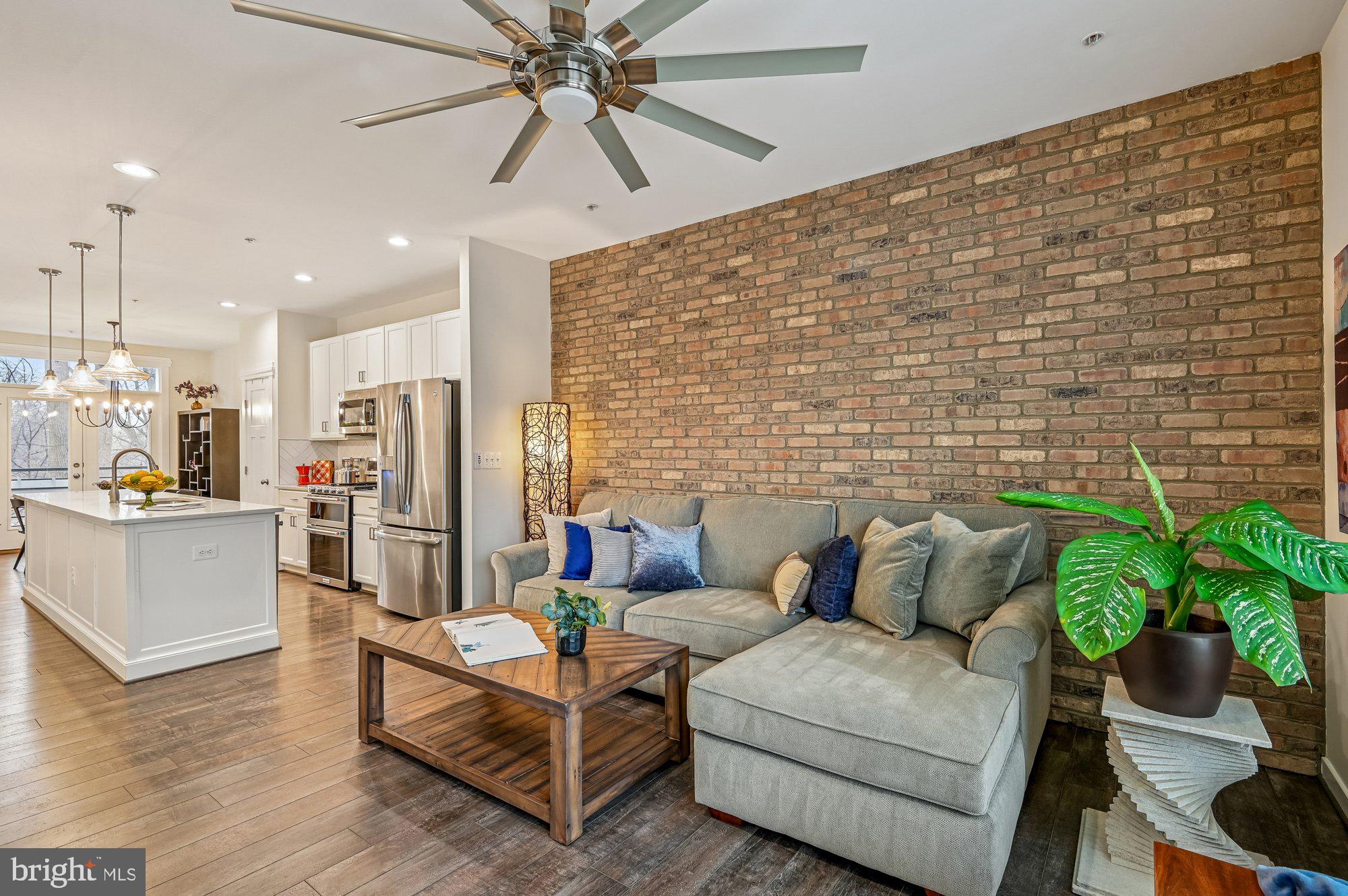 123 Lejeune Way Annapolis, MD 21401 - Photo 3 of 43 a living room with furniture and a potted plant