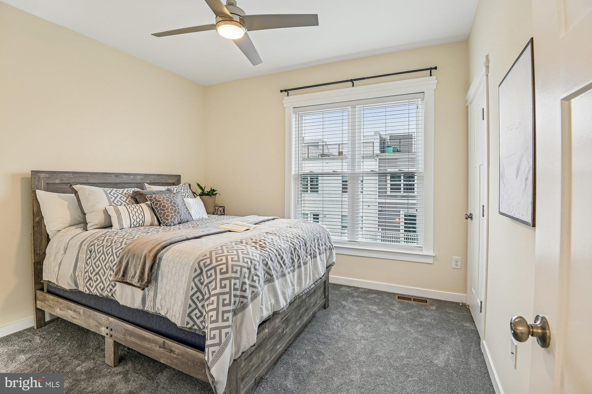 123 Lejeune Way Annapolis, MD 21401 - Photo 31 of 43 a large bed sitting in a bedroom next to a window