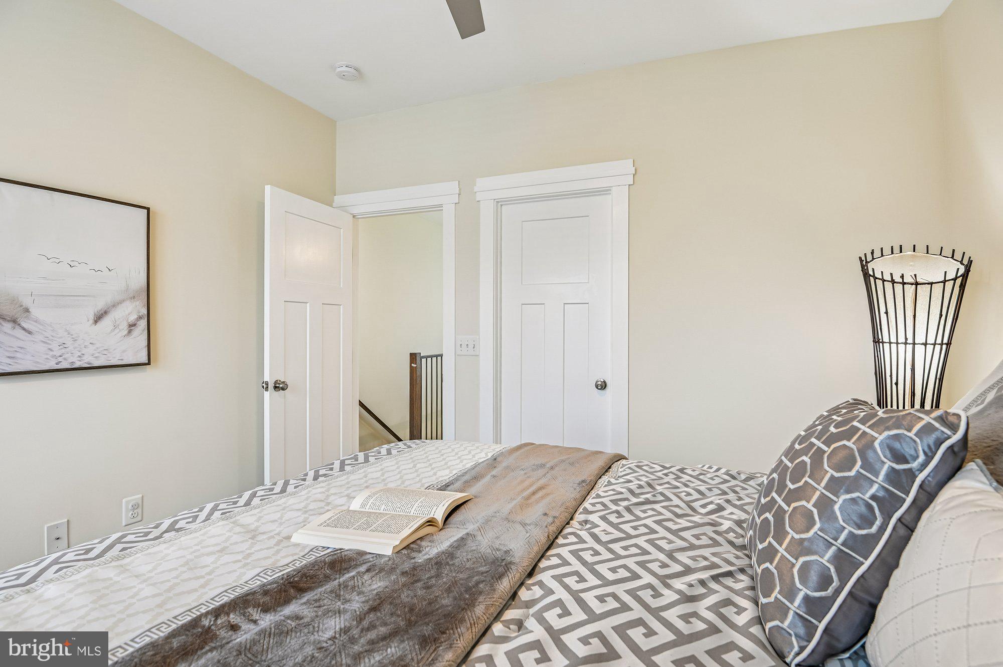 123 Lejeune Way Annapolis, MD 21401 - Photo 32 of 43 a bedroom with a bed and wooden floor