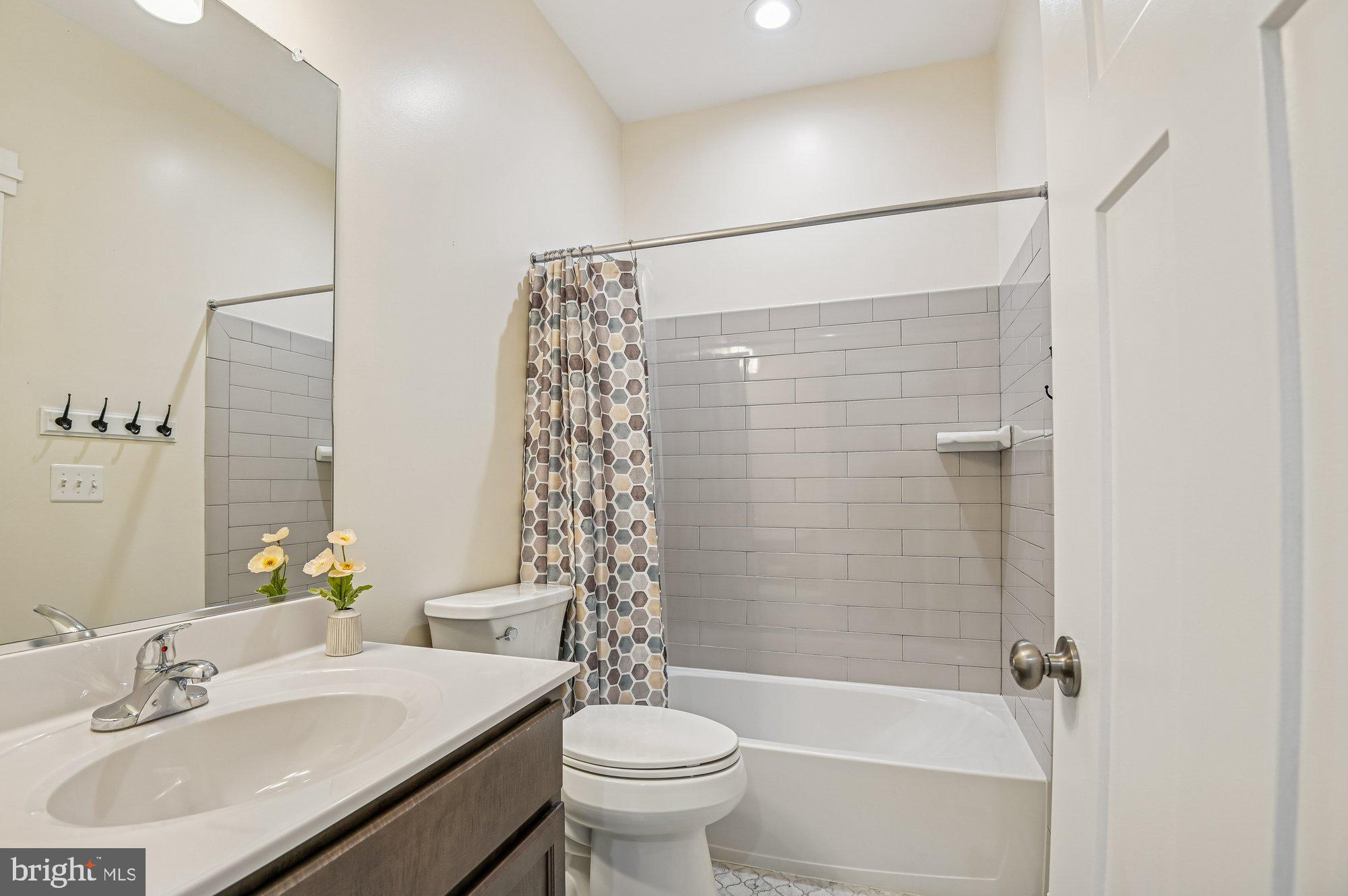 123 Lejeune Way Annapolis, MD 21401 - Photo 33 of 43 a bathroom with a sink toilet and shower
