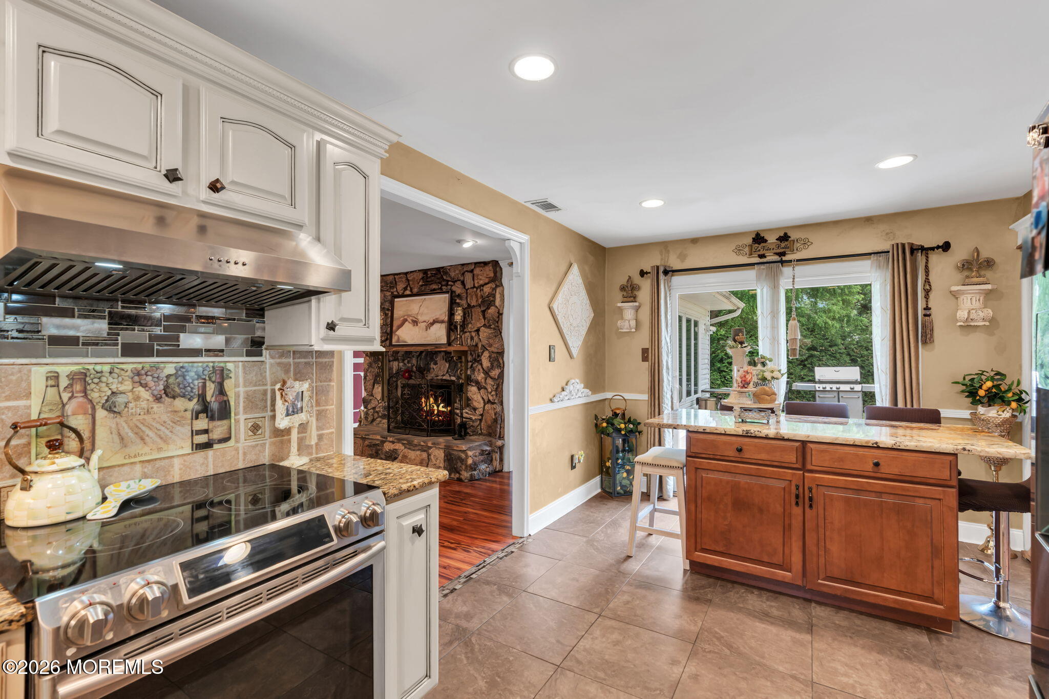 8 Owens Road Marlboro, NJ 07746 - Photo 17 of 39 a kitchen with a stove and a refrigerator