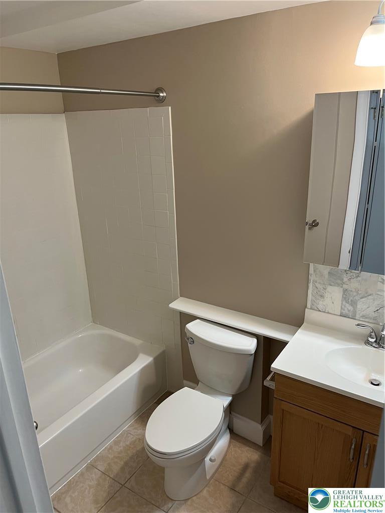 511 Prospect Avenue, Unit 2 Bethlehem, PA 18018 - Photo 7 of 9 a white toilet sitting next to a bath tub