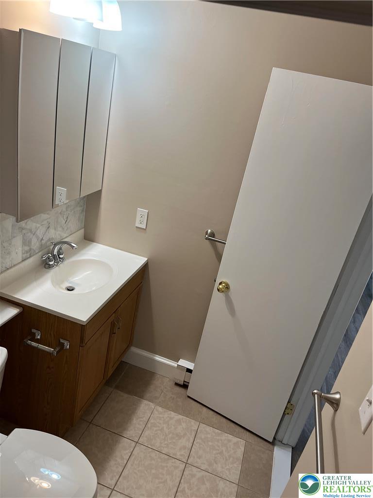 511 Prospect Avenue, Unit 2 Bethlehem, PA 18018 - Photo 8 of 9 a bathroom with a sink toilet and vanity