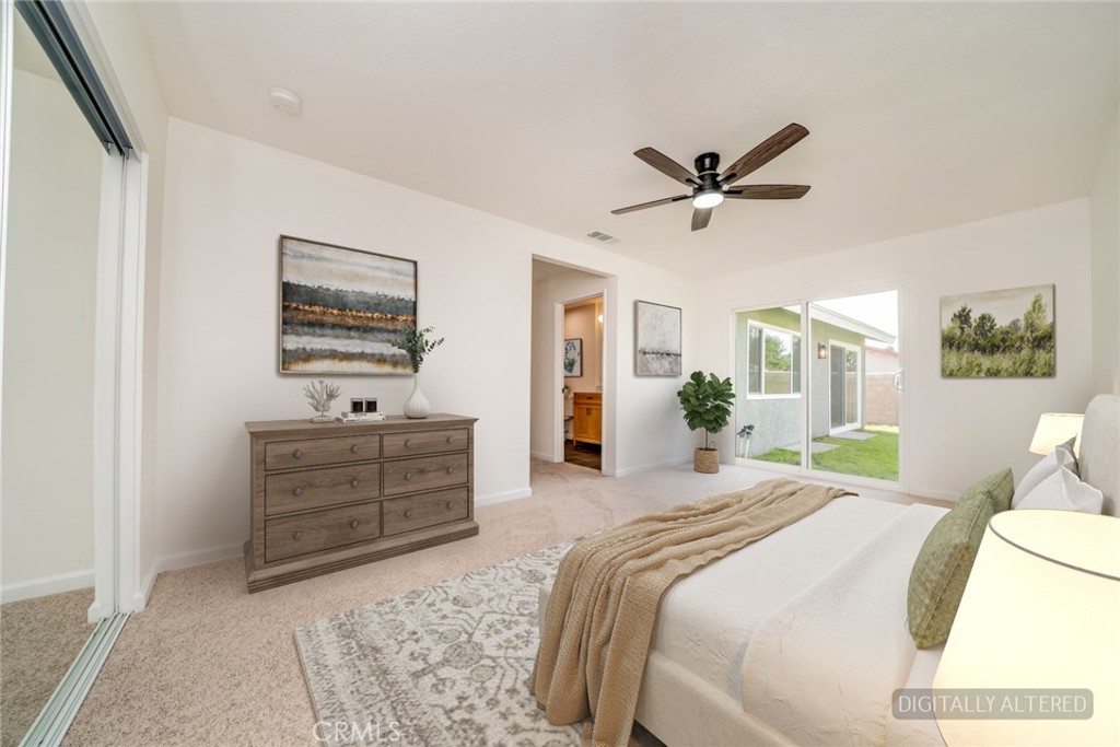 818 Terrace Road San Bernardino, CA 92410 - Photo 27 of 44 a bedroom with a bed and a dresser