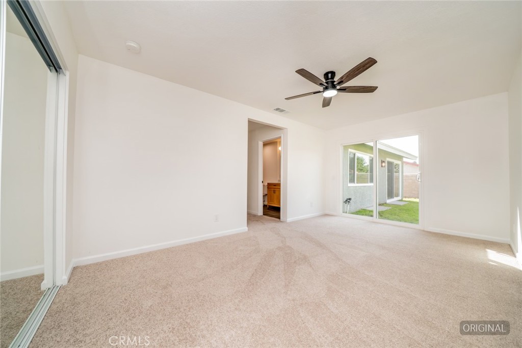 818 Terrace Road San Bernardino, CA 92410 - Photo 28 of 44 a view of a livingroom with a ceiling fan and window