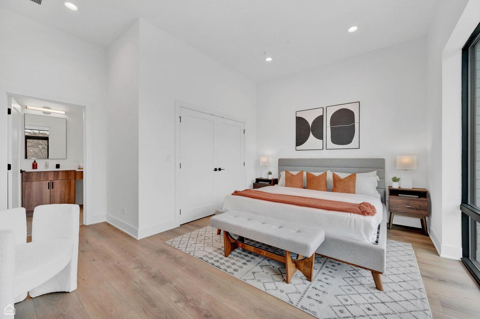 1607 West 13th Street, Unit 200 Chicago, IL 60608 - Photo 12 of 17 a bedroom with a bed and a chair
