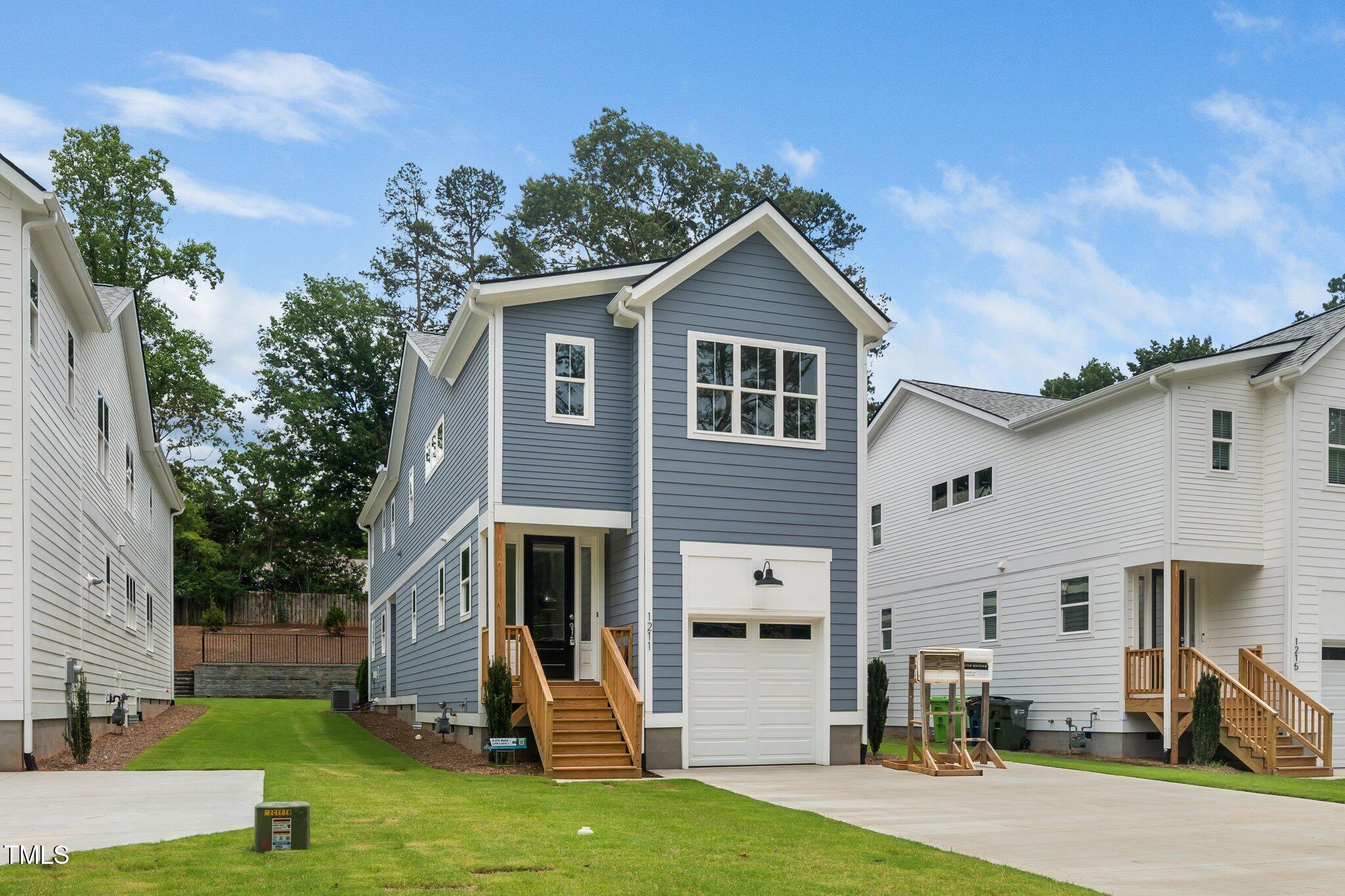 1211 Chaney Road Raleigh, NC 27606 - Photo 1 of 36 a view of a house with a yard