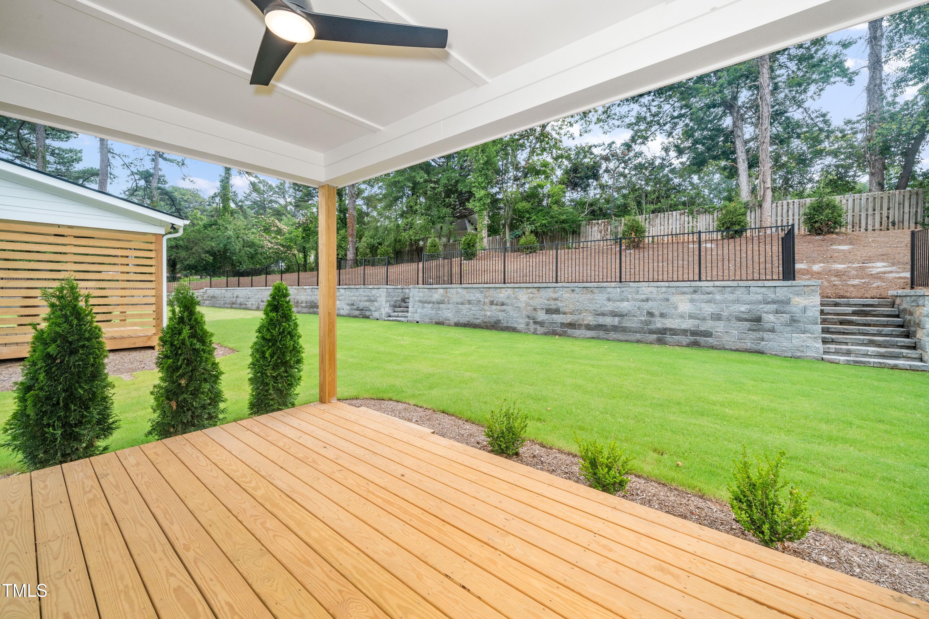 1211 Chaney Road Raleigh, NC 27606 - Photo 17 of 36 a view of a backyard with a garden
