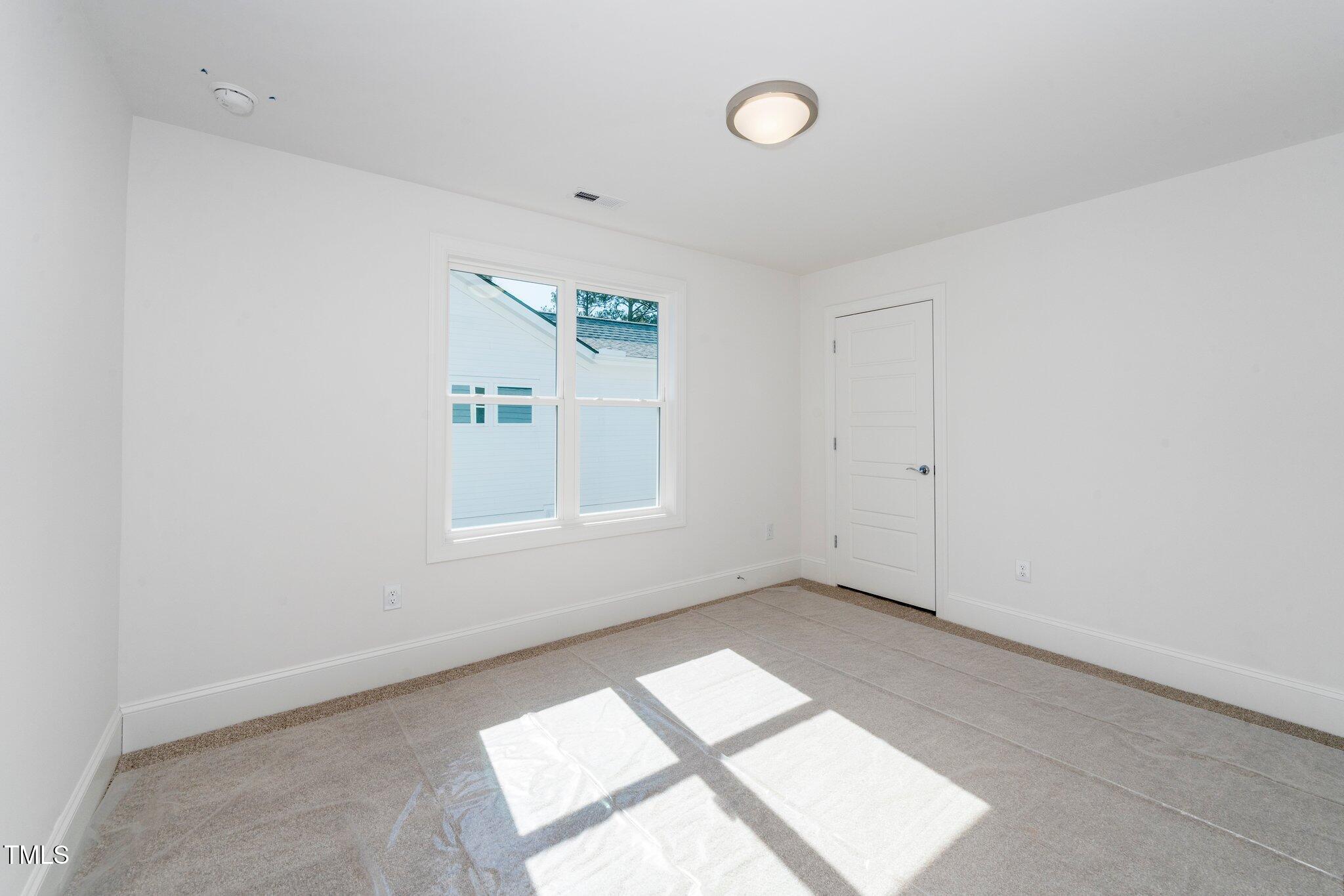 1211 Chaney Road Raleigh, NC 27606 - Photo 24 of 36 an empty room with windows
