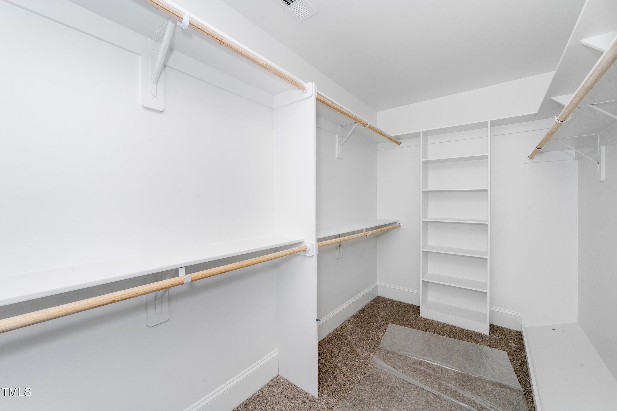 1211 Chaney Road Raleigh, NC 27606 - Photo 29 of 36 a view of an empty walk in closet