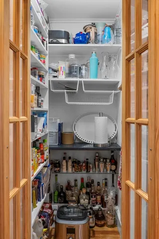 a kitchen with lots of different colored cloths