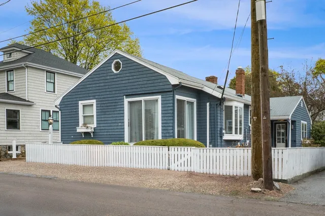 a house that has a tree in front of it