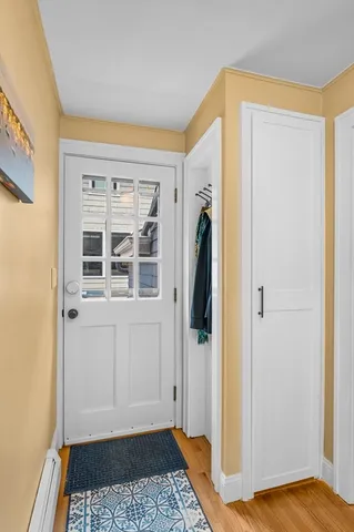 a view of front door with wooden floor