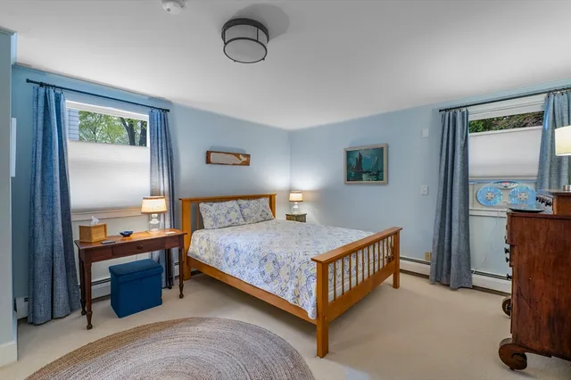 a bedroom with a bed and a mirror