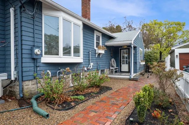 a front view of a house with garden