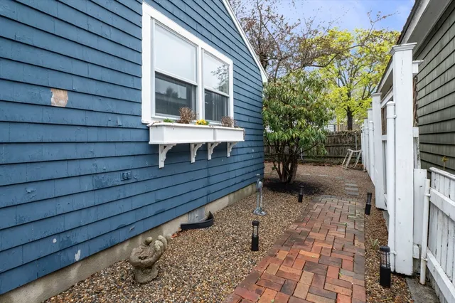 a bench is sitting in front of a house