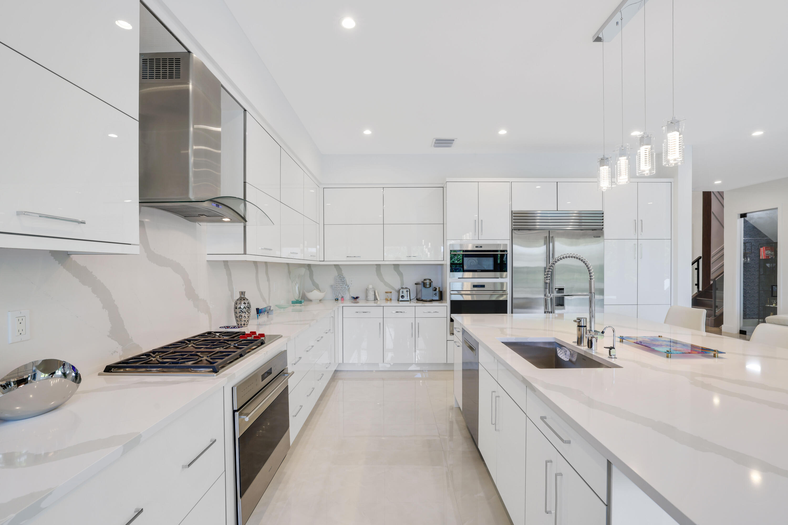 17052 Rainbow Fls Trail Boca Raton, FL 33496 - Photo 25 of 96 a kitchen with stainless steel appliances granite countertop a sink stove and refrigerator