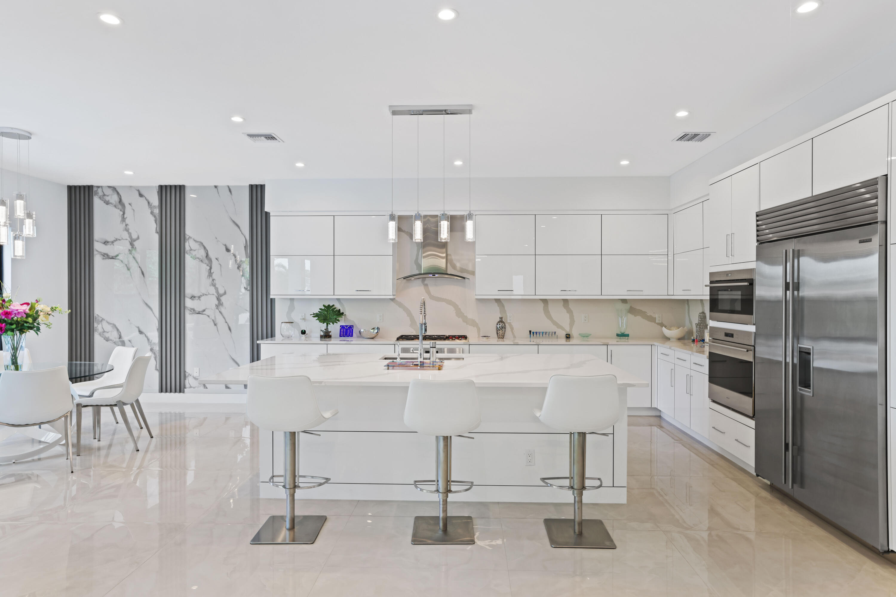 17052 Rainbow Fls Trail Boca Raton, FL 33496 - Photo 36 of 96 a kitchen with white cabinets and stainless steel appliances