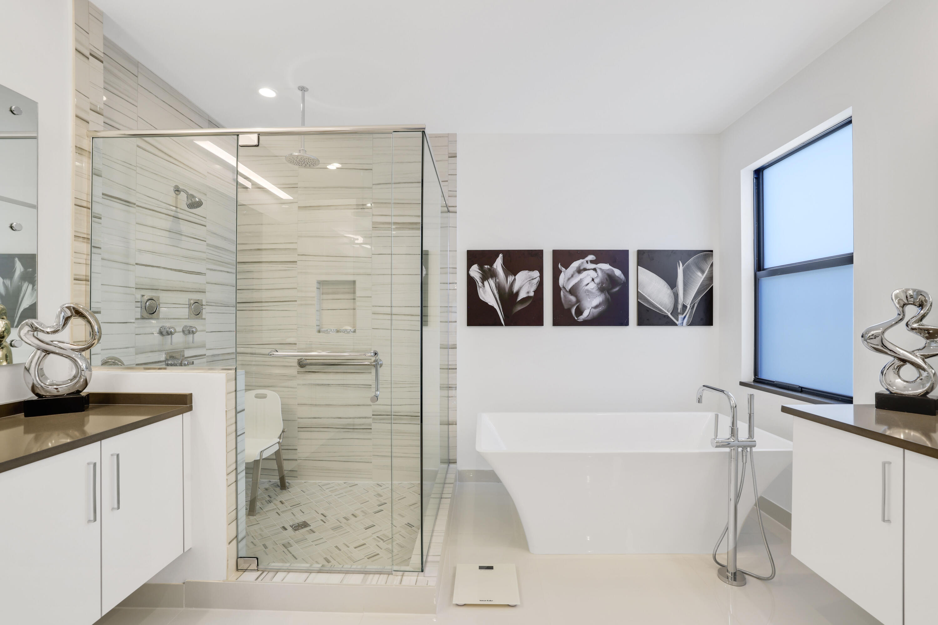 17052 Rainbow Fls Trail Boca Raton, FL 33496 - Photo 48 of 96 a bathroom with a bathtub and a shower