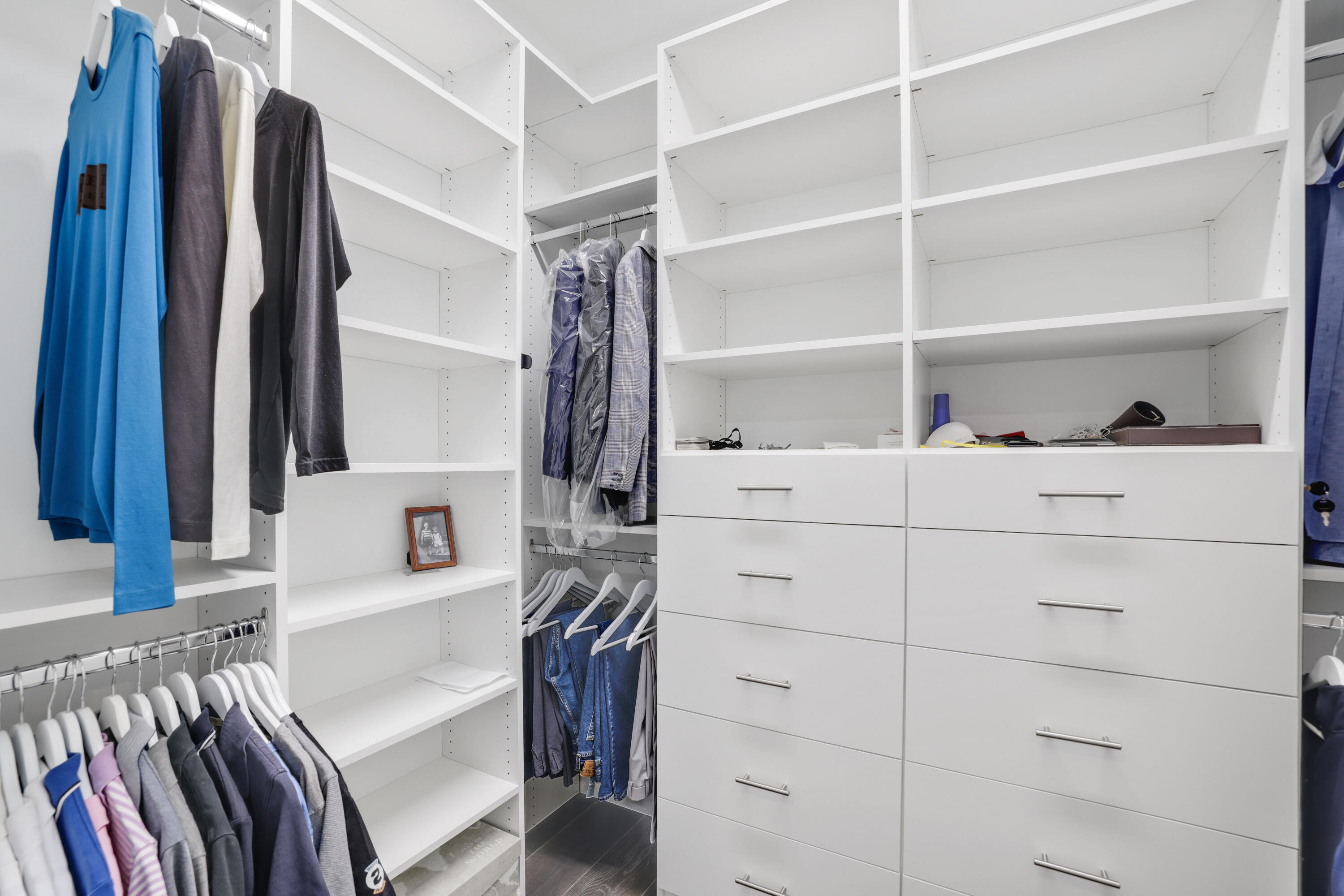 17052 Rainbow Fls Trail Boca Raton, FL 33496 - Photo 53 of 96 a view of walk in closet with clothes and shoes