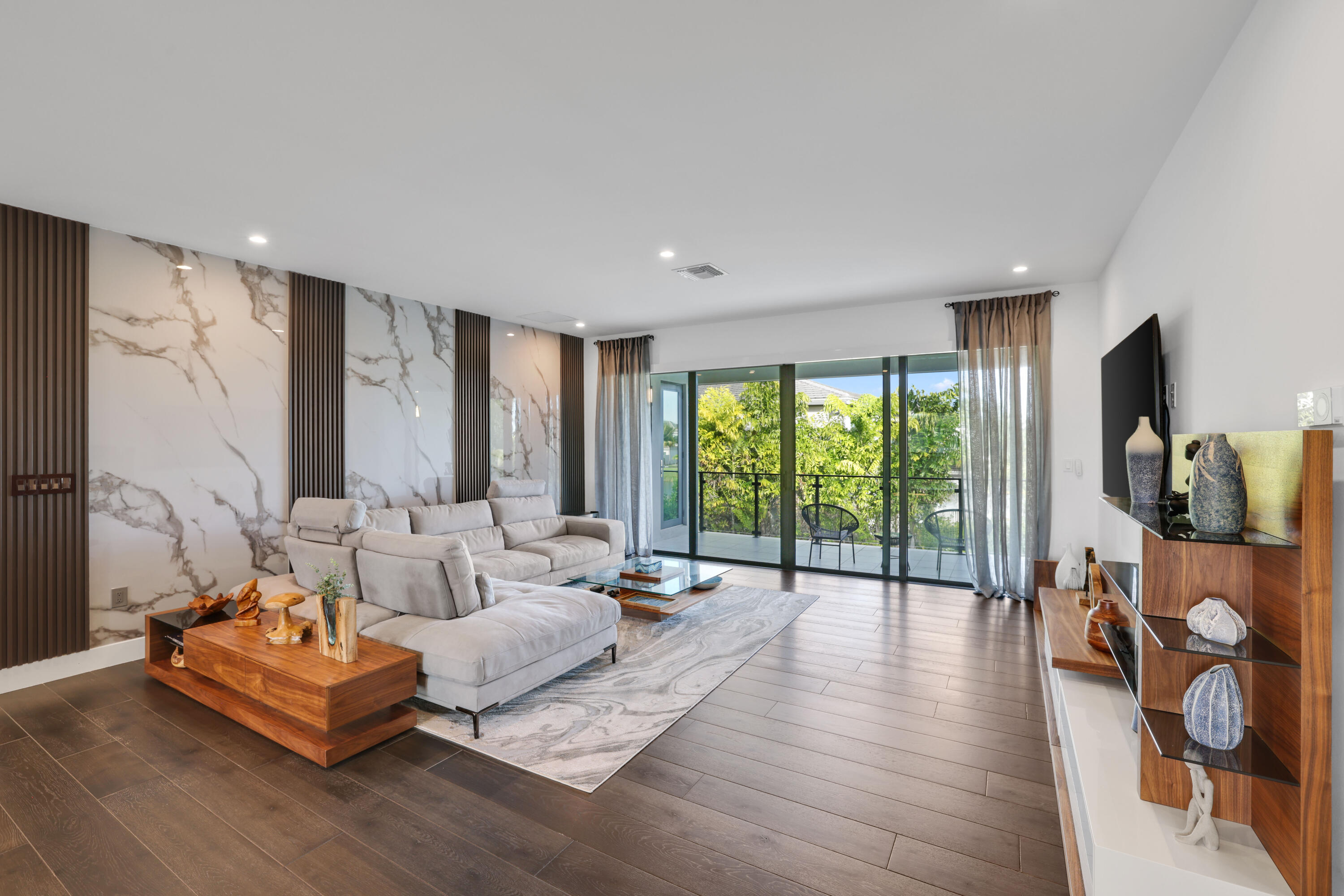 17052 Rainbow Fls Trail Boca Raton, FL 33496 - Photo 58 of 96 a living room with furniture and a flat screen tv
