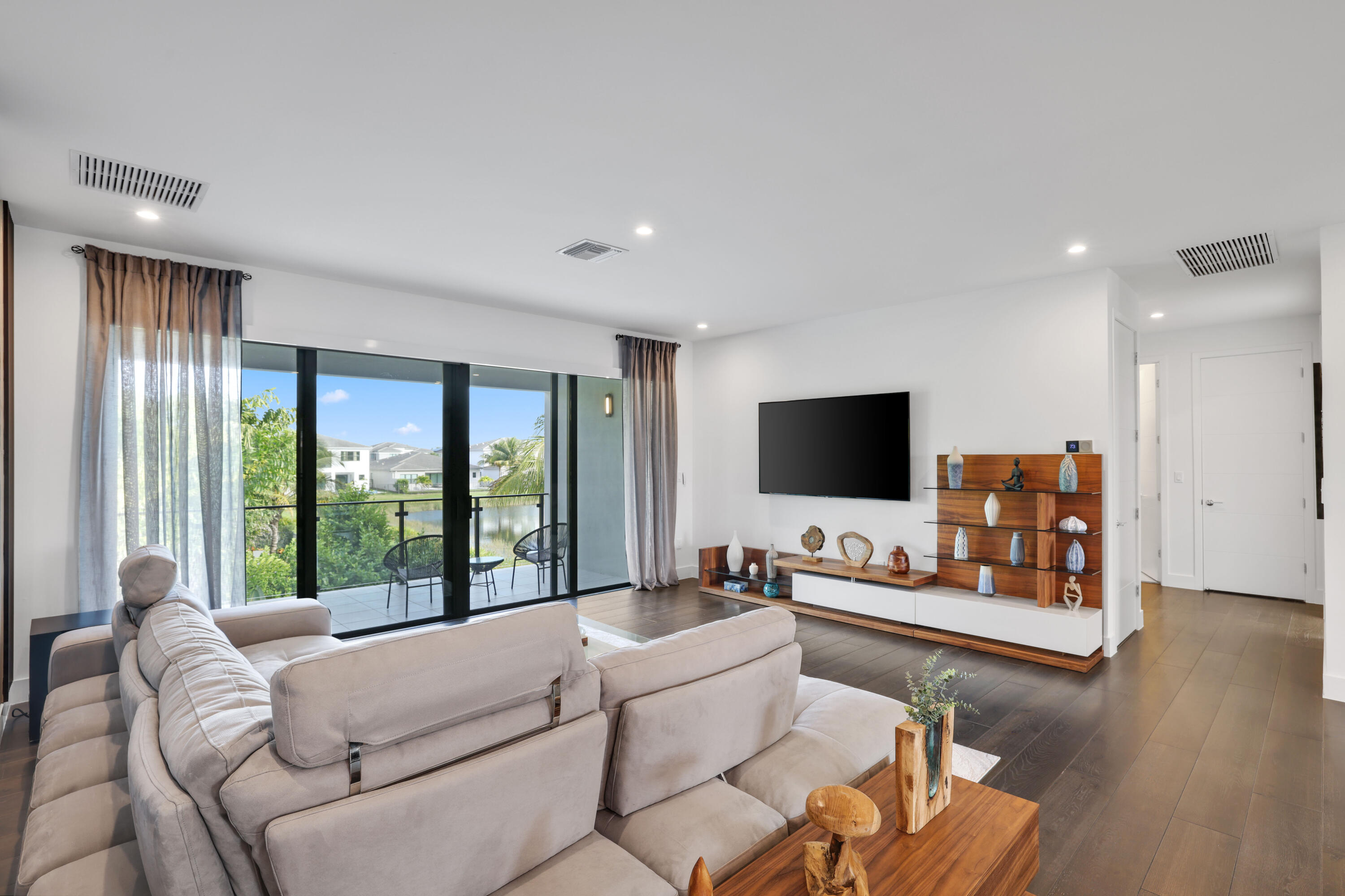 17052 Rainbow Fls Trail Boca Raton, FL 33496 - Photo 60 of 96 a living room with furniture and a flat screen tv