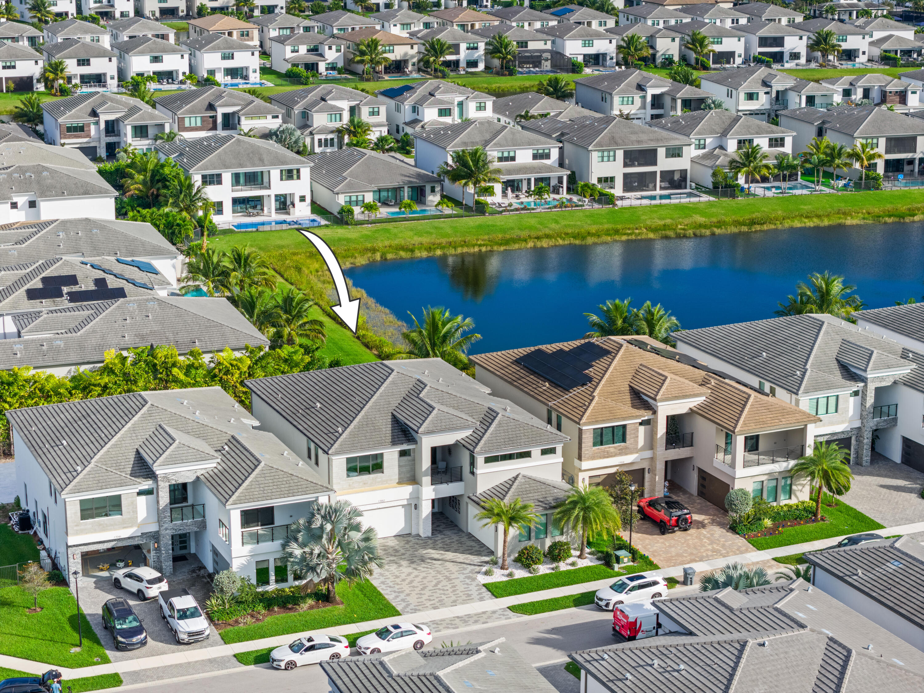 17052 Rainbow Fls Trail Boca Raton, FL 33496 - Photo 6 of 96 an aerial view of a house with a garden and lake view