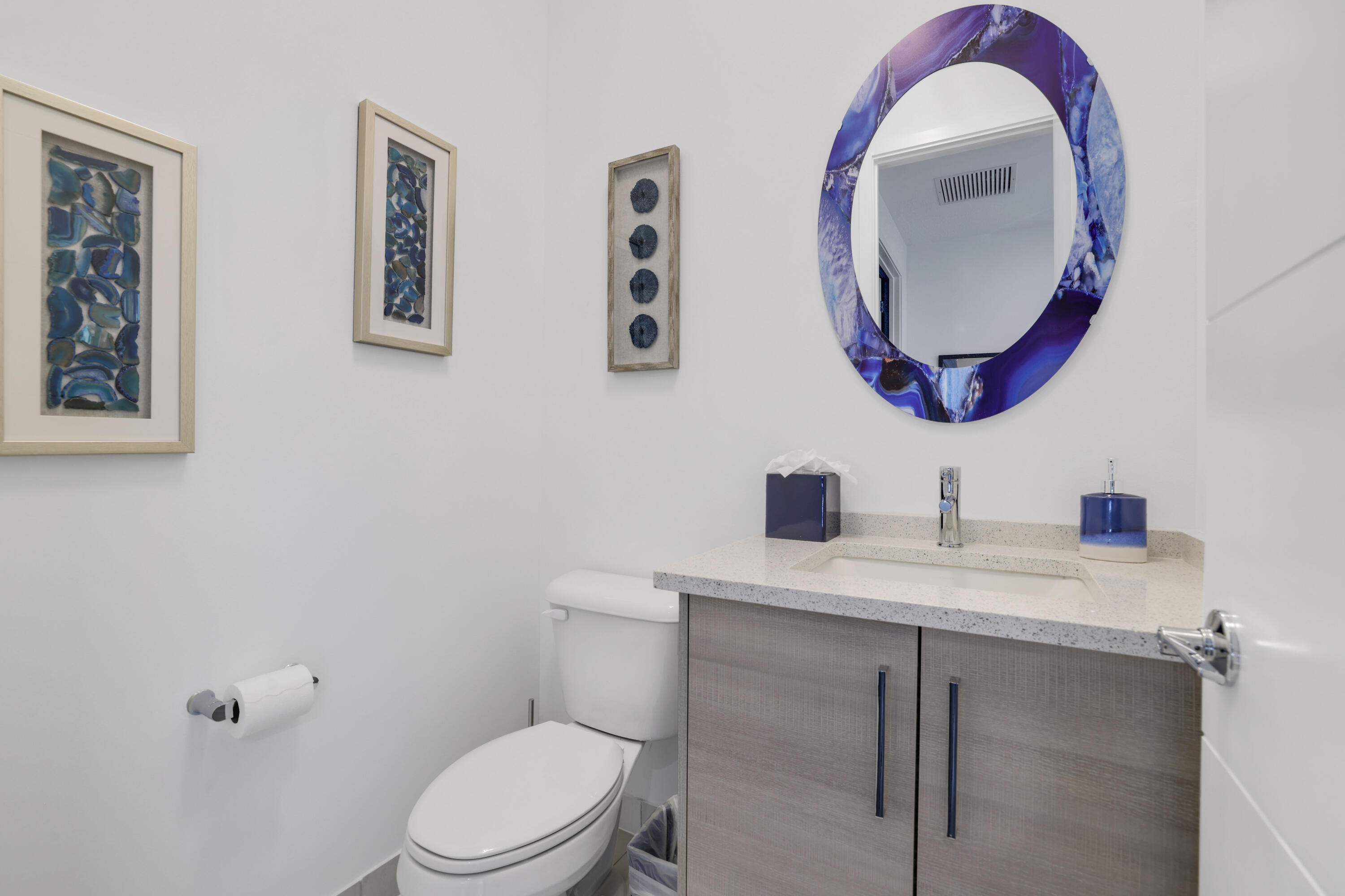17052 Rainbow Fls Trail Boca Raton, FL 33496 - Photo 66 of 96 a bathroom with a toilet a sink and a mirror