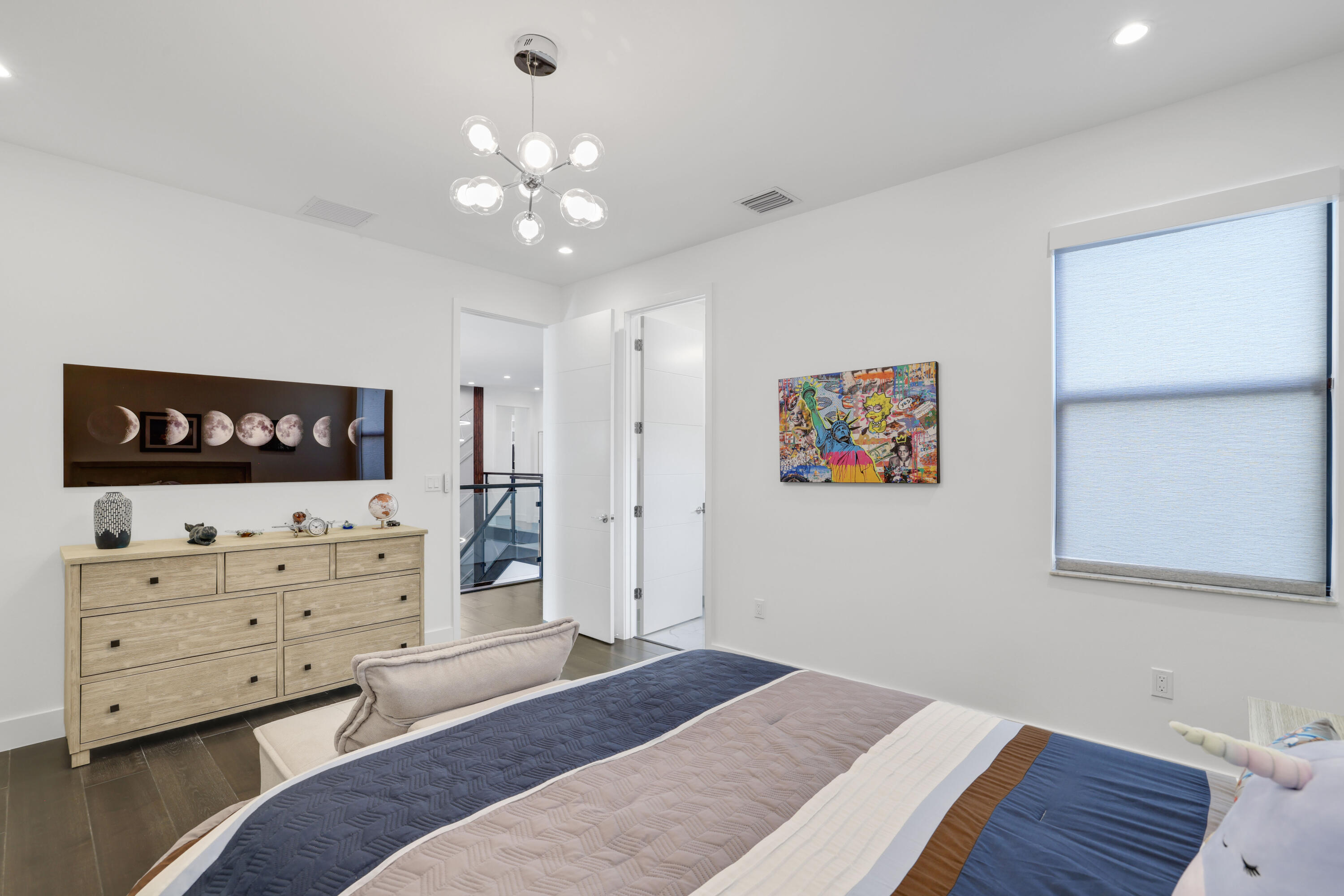 17052 Rainbow Fls Trail Boca Raton, FL 33496 - Photo 70 of 96 a bedroom with a bed and a dresser