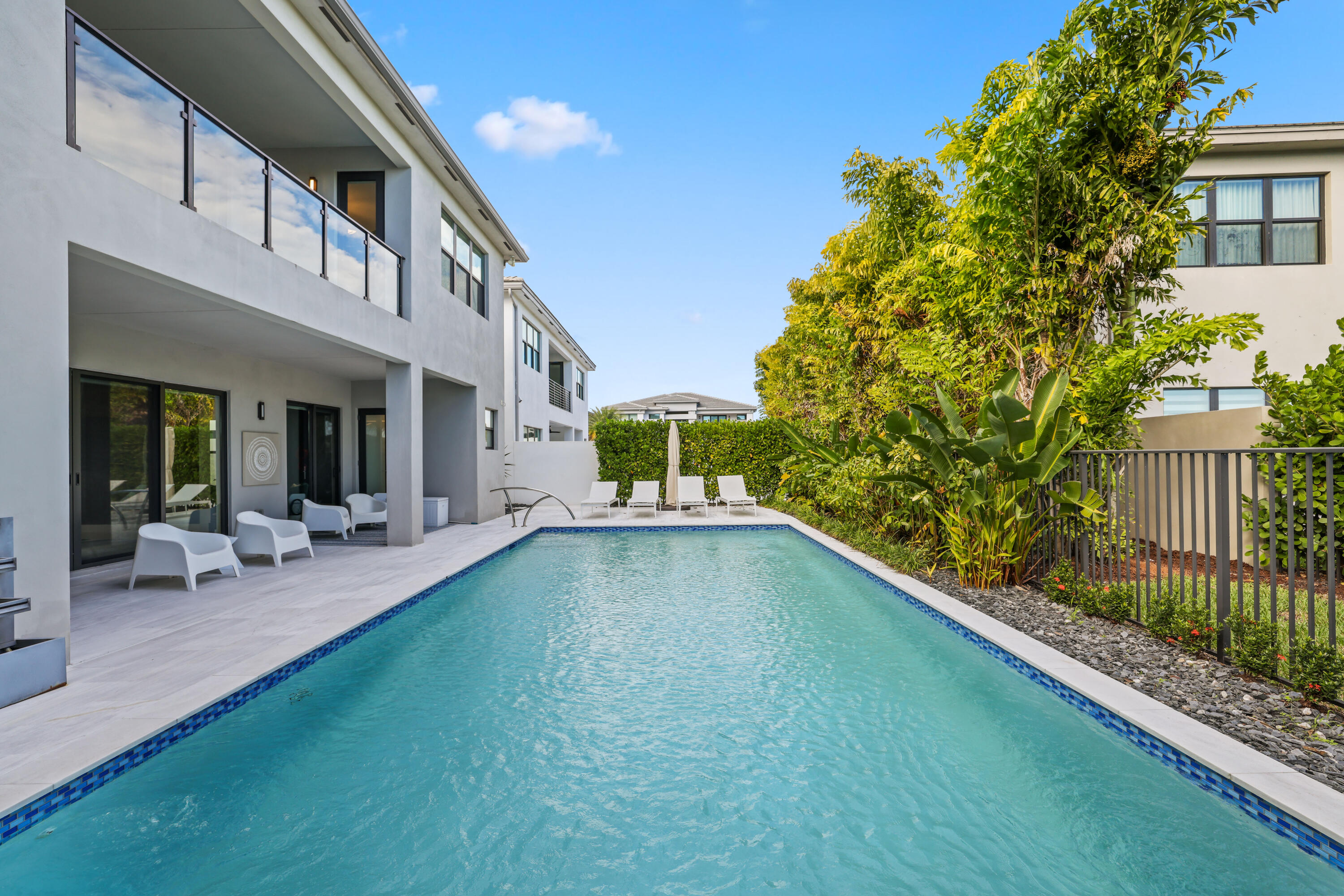17052 Rainbow Fls Trail Boca Raton, FL 33496 - Photo 83 of 96 a view of an house with backyard porch and garden