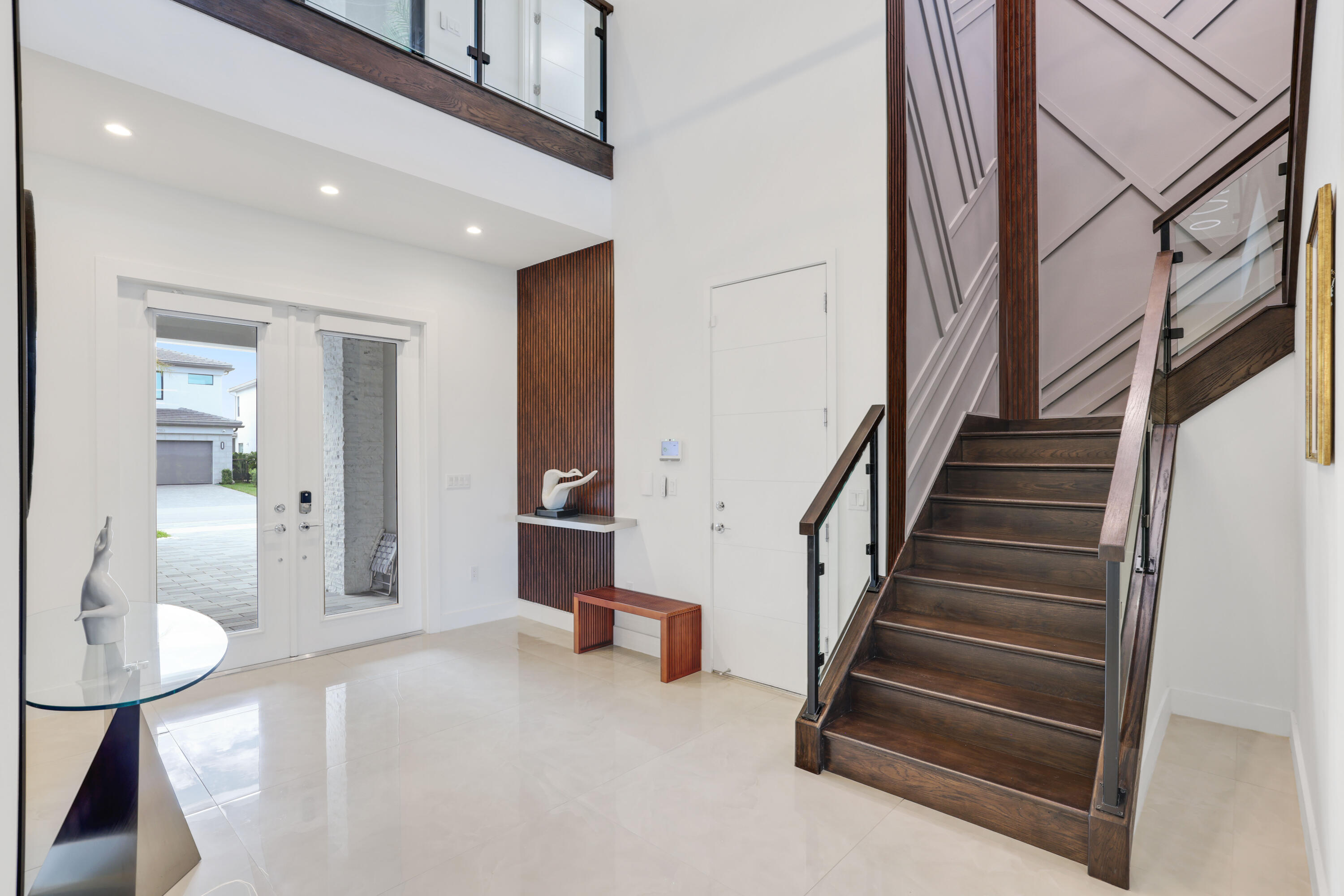 17052 Rainbow Fls Trail Boca Raton, FL 33496 - Photo 9 of 96 a view of entryway and hall with wooden floor