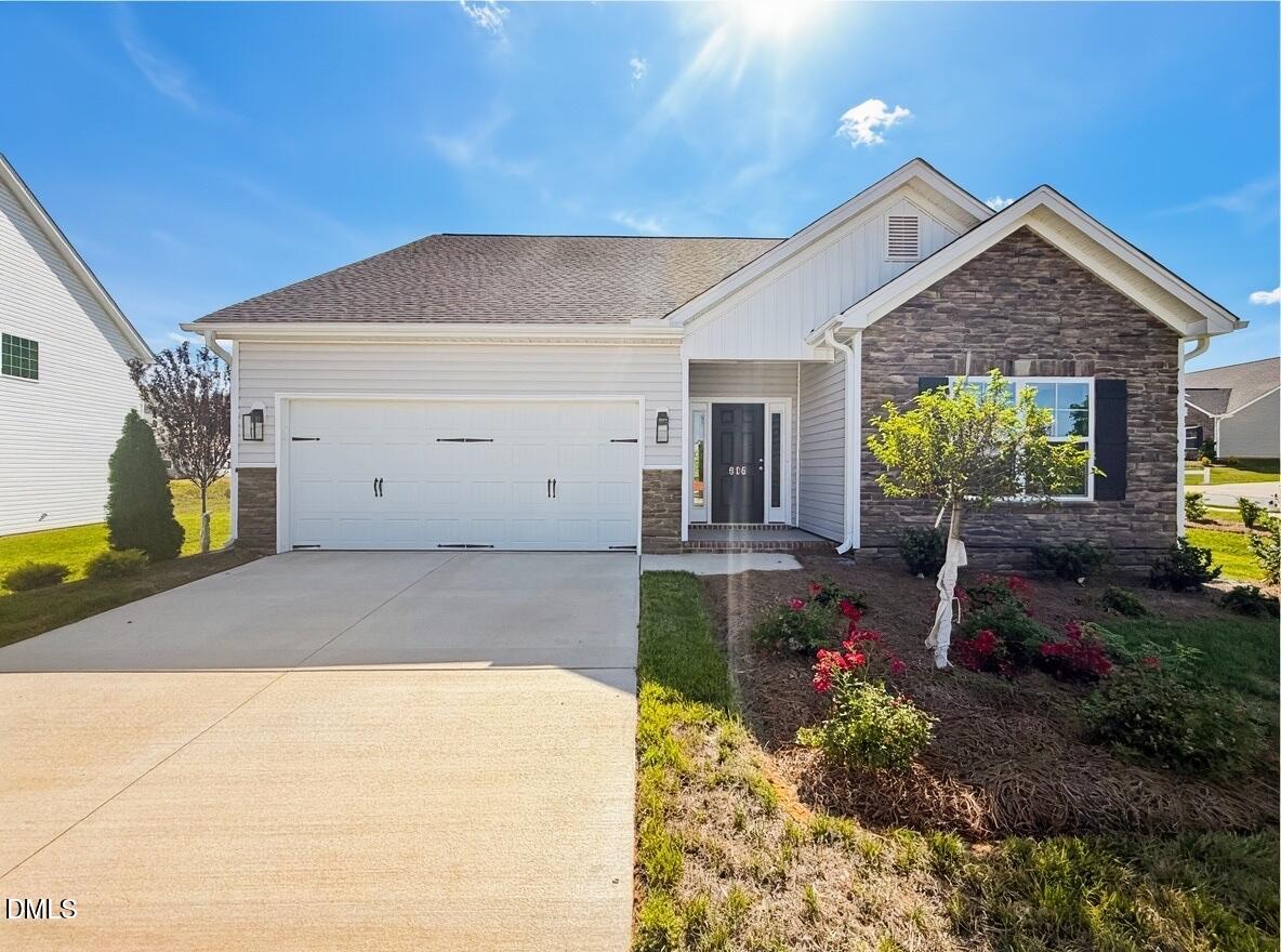 816 Council Rdg Road, Unit 15 Graham, NC 27253 - Photo 1 of 7 a front view of a house with garden