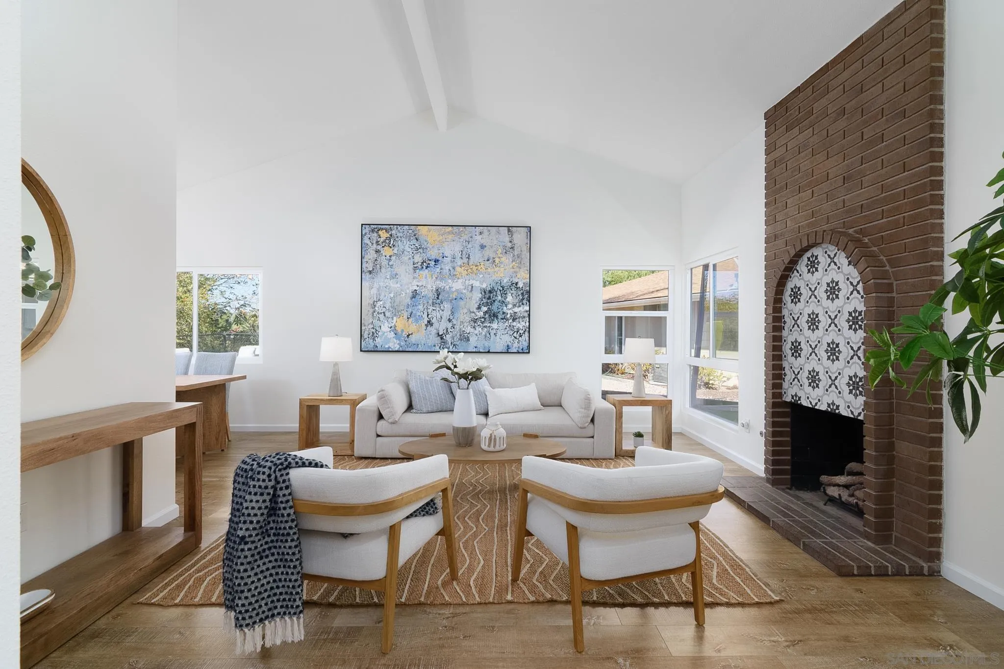 16556 Gabarda Road San Diego, CA 92128 - Photo 1 of 42 a living room with furniture and a fireplace