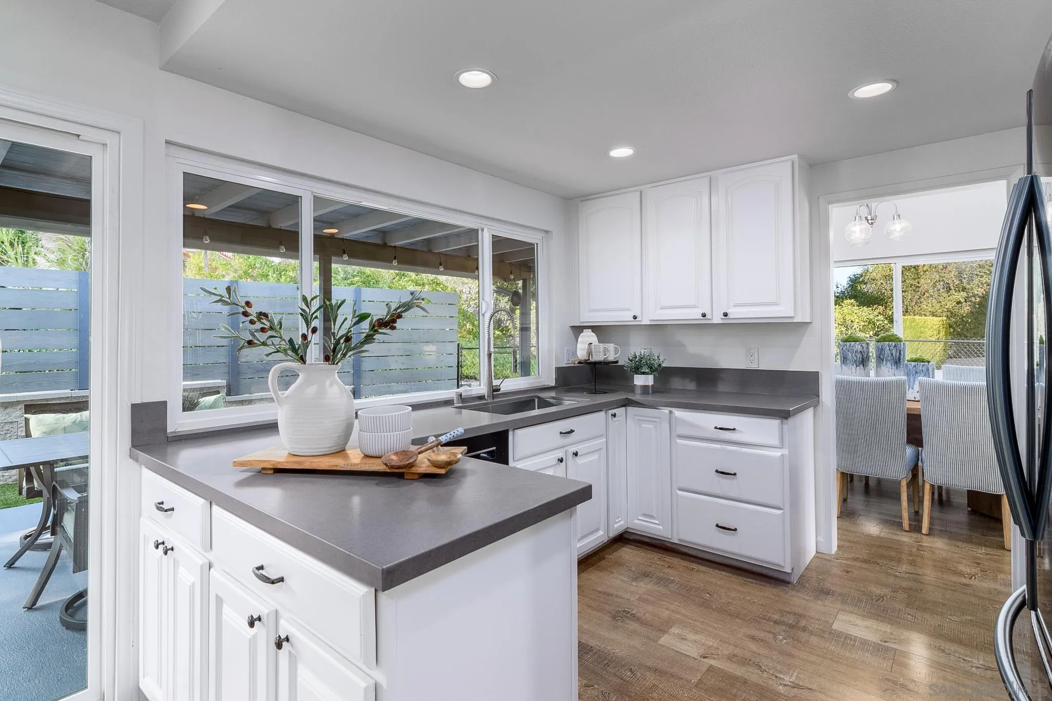 16556 Gabarda Road San Diego, CA 92128 - Photo 13 of 42 a kitchen with stainless steel appliances granite countertop a stove a sink and a refrigerator