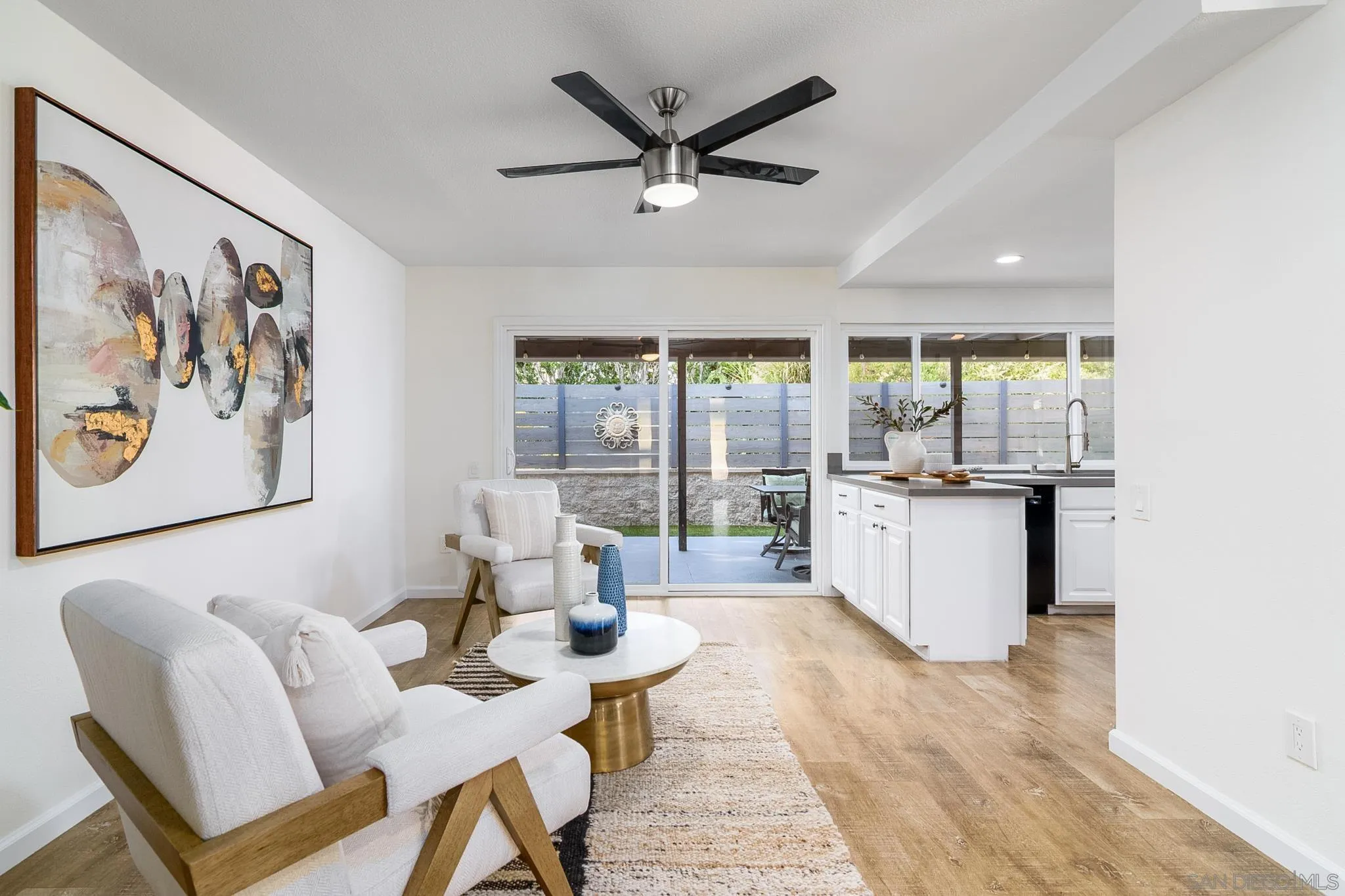 16556 Gabarda Road San Diego, CA 92128 - Photo 16 of 42 a living room with furniture and a large window
