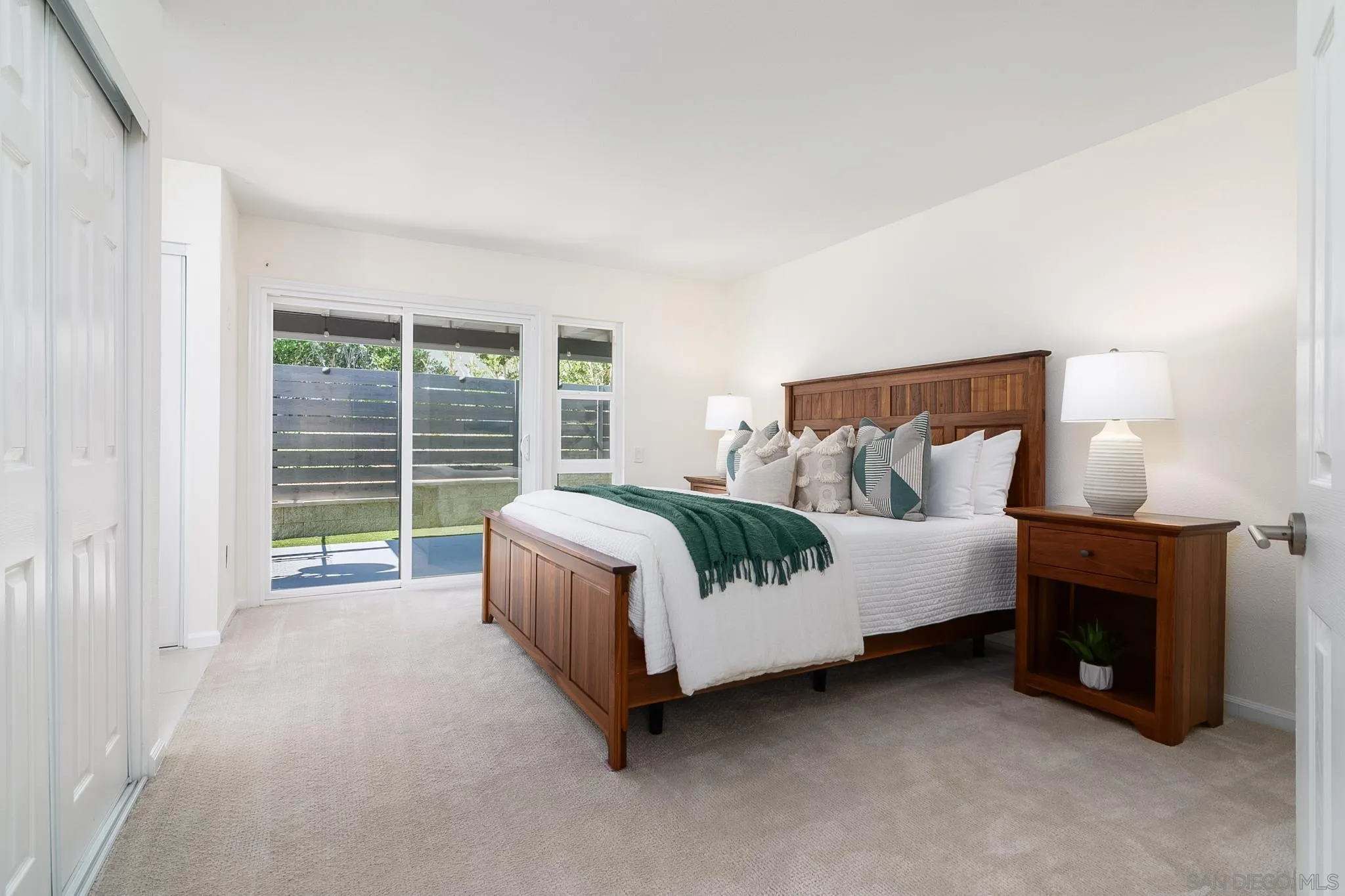 16556 Gabarda Road San Diego, CA 92128 - Photo 18 of 42 a bed room with a bed and a fireplace