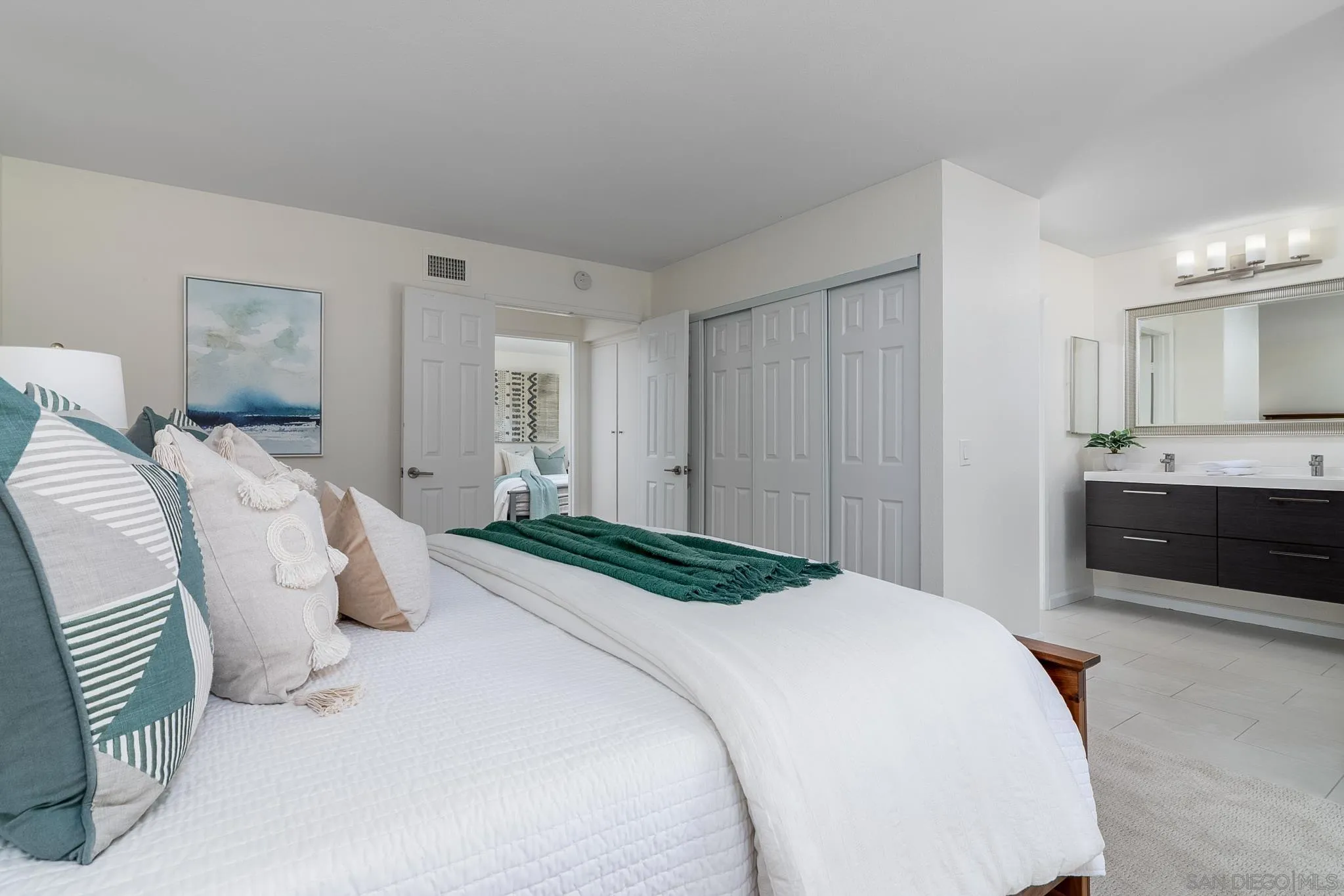 16556 Gabarda Road San Diego, CA 92128 - Photo 20 of 42 a bedroom with a bed and a view of kitchen