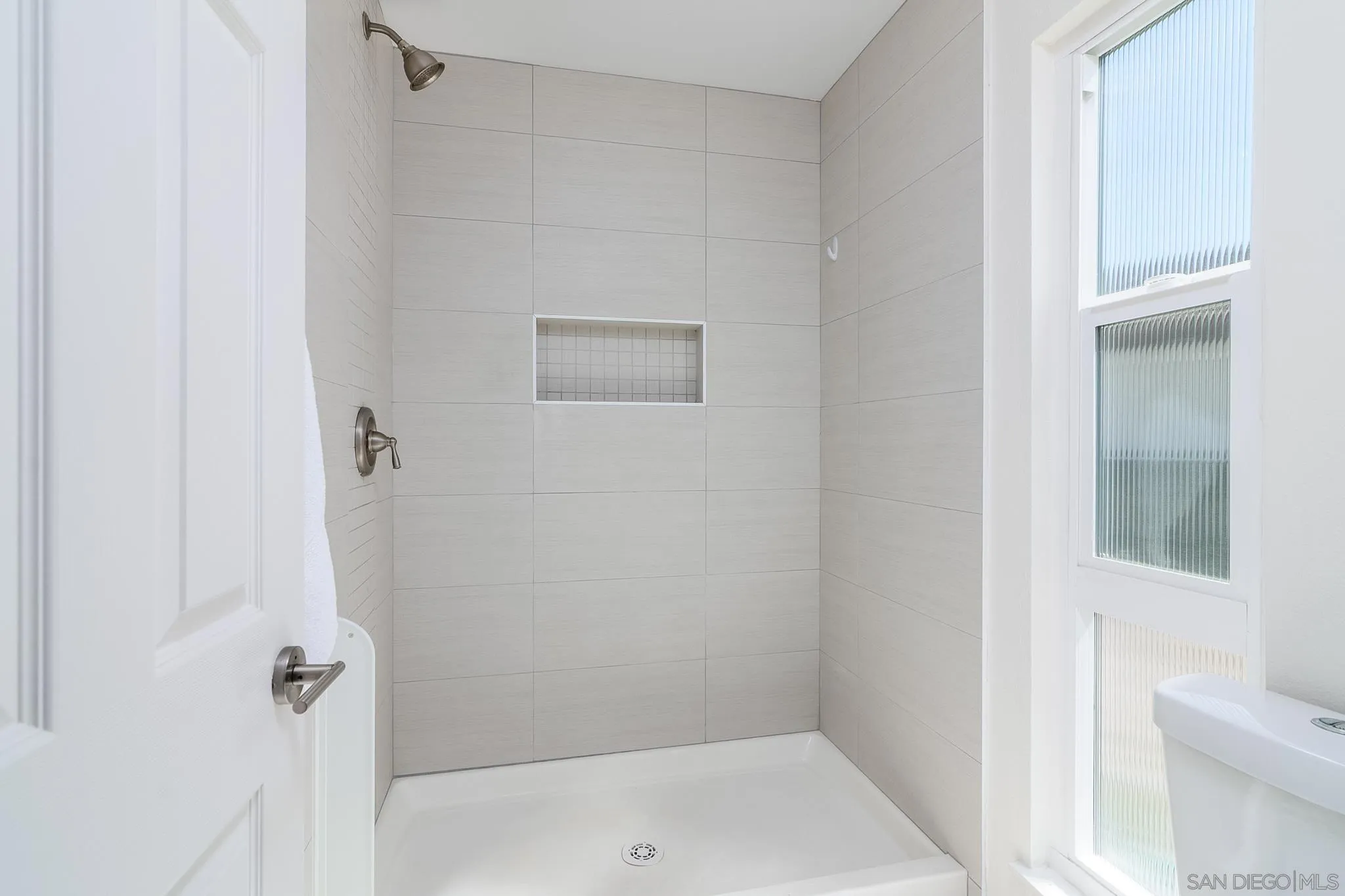 16556 Gabarda Road San Diego, CA 92128 - Photo 23 of 42 a bathroom with a shower