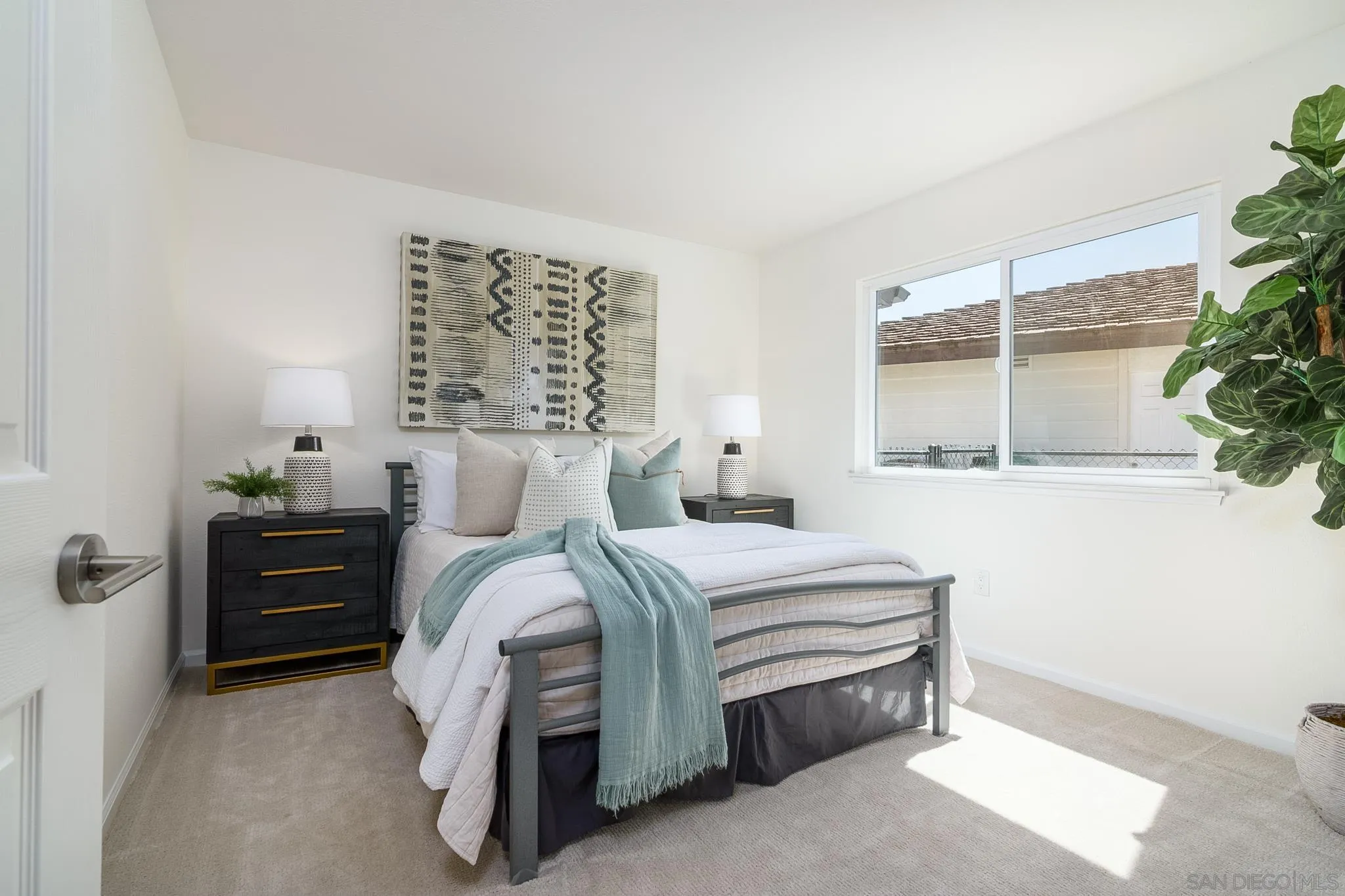 16556 Gabarda Road San Diego, CA 92128 - Photo 24 of 42 a bedroom with a bed and a window