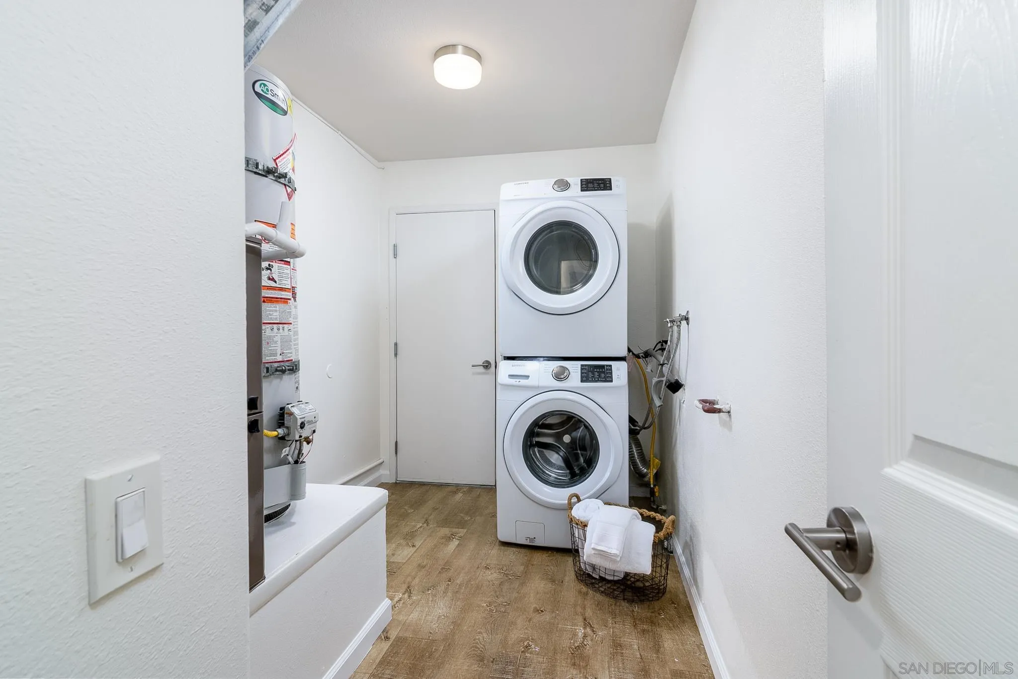 16556 Gabarda Road San Diego, CA 92128 - Photo 28 of 42 a utility room with dryer and washer