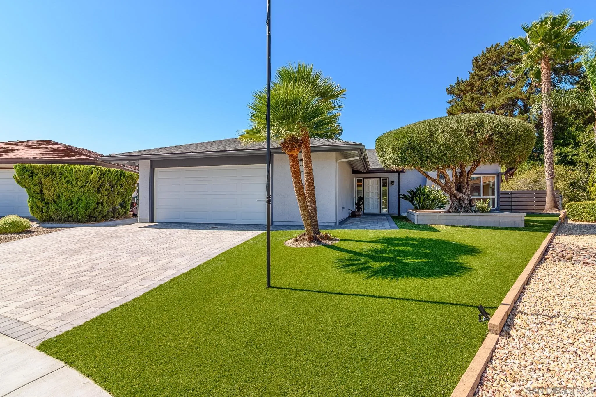 16556 Gabarda Road San Diego, CA 92128 - Photo 3 of 42 a view of a house with a backyard