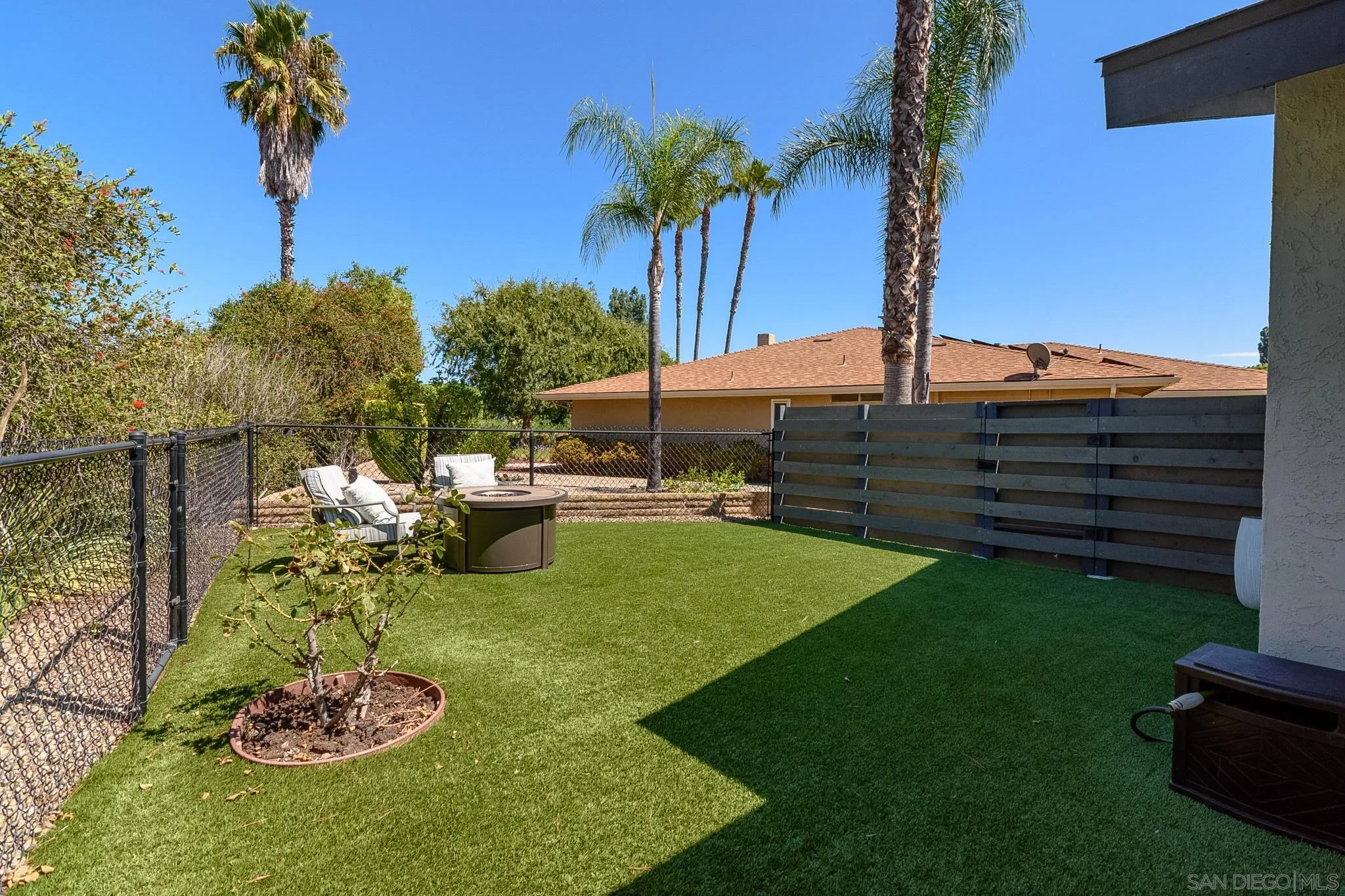 16556 Gabarda Road San Diego, CA 92128 - Photo 31 of 42 a view of a garden with a slide