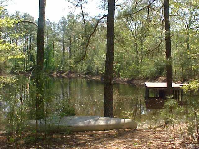 7021 Holly Springs Road Raleigh, NC 27606 - Photo 3 of 10 Pond with pier.