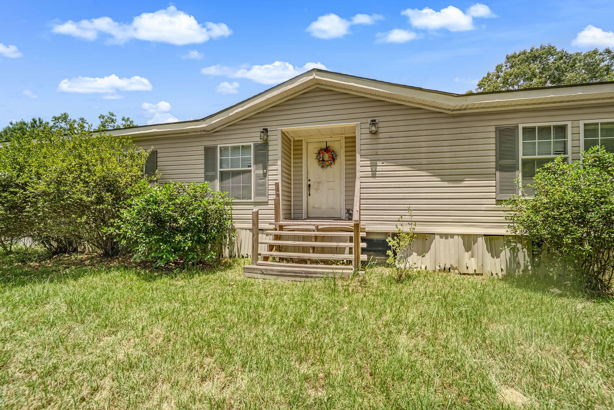25979 Shade Tree Lane Splendora, TX 77372 - Photo 9 of 22 The current manufactured home is equipped with established utility connections, creating a convenient starting point for buyers.