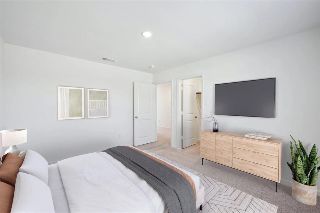 2012 Prairie Lane Melissa, TX 75454 - Photo 11 of 22 a bedroom with a bed and a couch