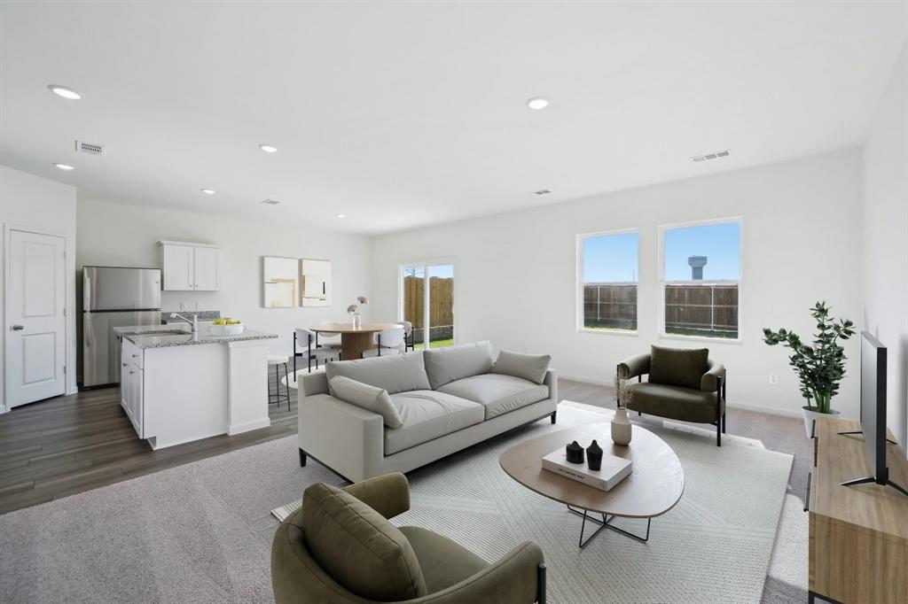 2012 Prairie Lane Melissa, TX 75454 - Photo 3 of 22 a living room with furniture and kitchen view