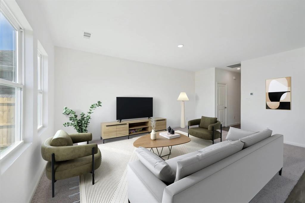 2012 Prairie Lane Melissa, TX 75454 - Photo 4 of 22 a living room with furniture and a flat screen tv