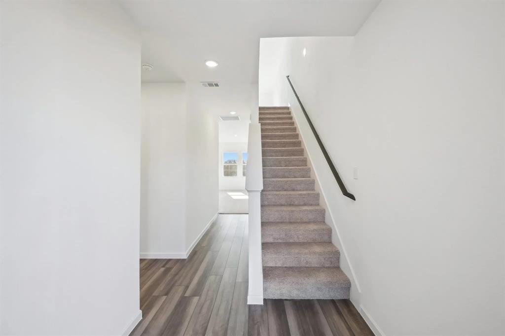 2012 Prairie Lane Melissa, TX 75454 - Photo 10 of 22 a view of entryway and hall with wooden floor